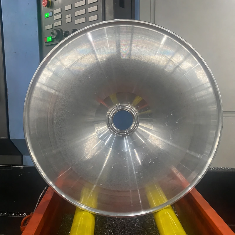Aluminum wheel blank at a representative CNC machining stage