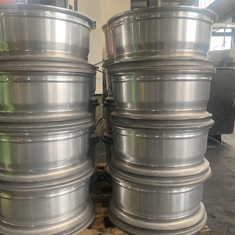 Unfinished aluminum wheel barrels in a representative manufacturing stage